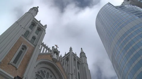 Tower block and church with clouds time lapse Stock Footage 1034479