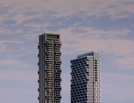Tower blocks on the background of the evening sky Stock Photos