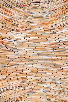 Tower of books creating textured pattern Foto stock