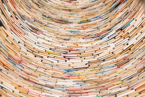 Tower of books creating textured pattern Stock Photos