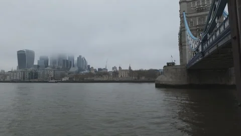Tower Bridge and London’s modern skyline with skyscrapers hidden in the fog. Stock Footage 297113831