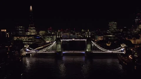 Tower Bridge and The Shard Illuminated Against London's Night Sky Stock Footage 296516388