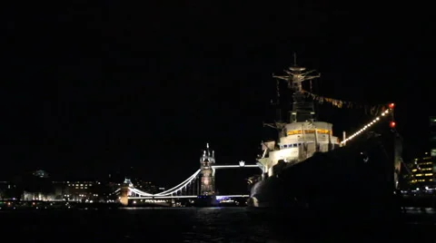 Tower Bridge in the background of HMS Belfast at night (London) Stock-Footage 46164481