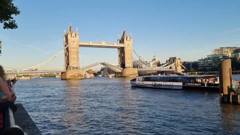 Tower Bridge Closing as Uber Boat Passes on the River Thames in London, UK Stock Footage 310914397