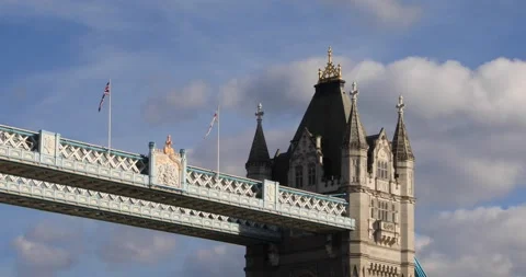 Tower Bridge detail with flags and stone turrets under London afternoon sky Stock Footage 319793485
