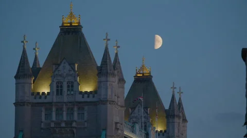 Tower Bridge at dusk with warm lights highlighting its historic towers. Stock Footage 321607549