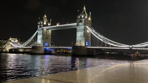 Tower Bridge Illuminated at Night Over River Thames, London, UK Stock Footage 342710315