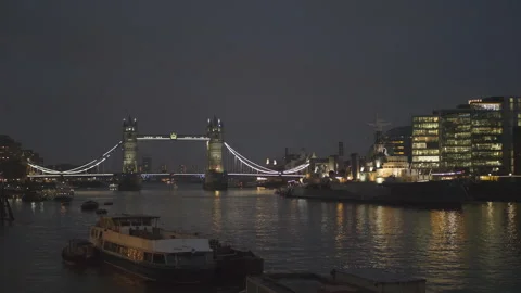 The Tower Bridge lit up at night over Thames River. Stock Footage 304843667