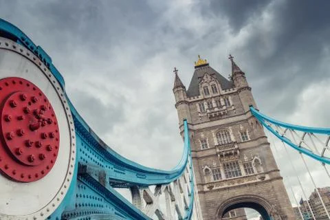 The Tower Bridge in London with dramatic cloudy sky. Stock Photos