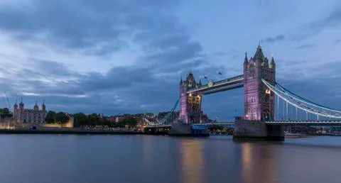 Tower Bridge, London, at sunset, with the river Thames in the foreground Stock Photos
