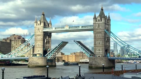 Tower Bridge With Raised Bascules Allowing River Traffic To Pass Stock Footage 338357968