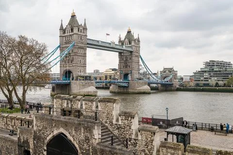 Tower Bridge seen over the outer wall of The Tower of London, London, England Stock Photos