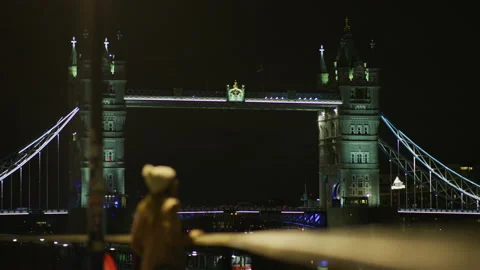 Tower Bridge seen from the river bank, at night Stock Footage 217097995