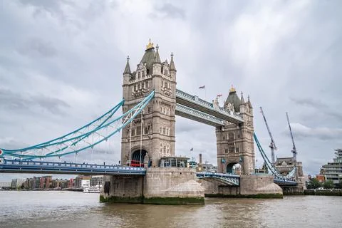 Tower Bridge Spans the Thames with Its Gothic Towers and Blue Cables, Remai.. Stock Photos