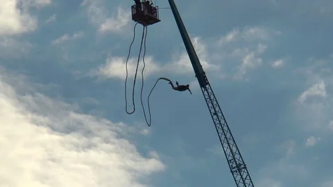 A tower for bungee jumping, daredevil jumps down. Stock Footage 113880186