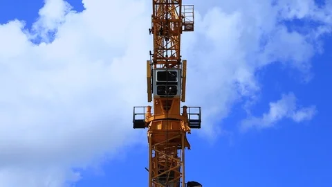 Tower Cane Pulling up the Hook in a Cloudy Blue Sky Stock Footage 95909557