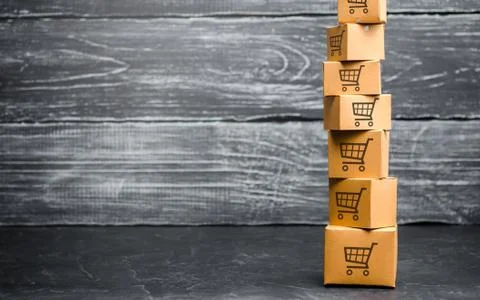 Tower of cardboard boxes with pattern of shopping carts. Purchasing power, de Stock Photos