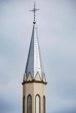 Tower of a Catholic church in a triangular shape 스톡 사진