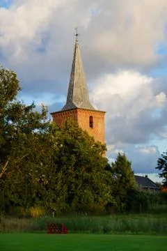 Tower of church between trees Stock Photos