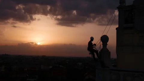 Tower Climber Climbing Aerial View Wide Shot Drone Above Safety Repair Worker 動画素材 127617309