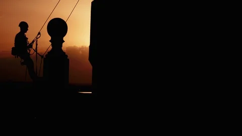 Tower Climber Climbing Sunset Aerial View Wide Shot Chimney Drone Above Worker Stock Footage 127628442