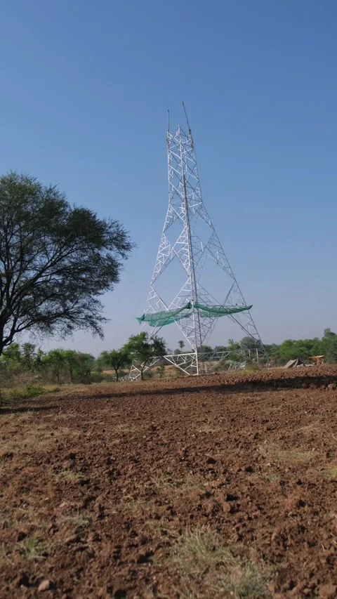 Tower Construction in Field – Electricity Infrastructure Vídeos de archivo 333451635