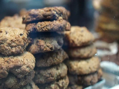 Tower of cookies stack display through pastry shop window Stock Footage 74560474