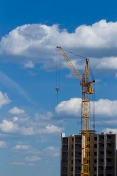 Tower crane on the background of the building is building Stock Photos