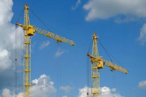 Tower crane on a background of clouds Stock Photos
