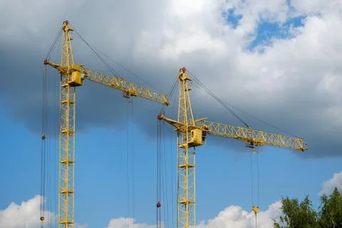 Tower crane on a background of clouds Stock Photos