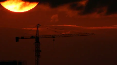 Tower crane at background sunset sky Stock Footage 115953832