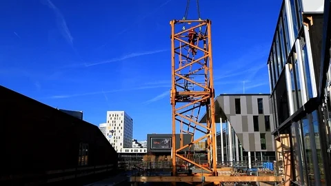 Tower Crane Base Disassembled and Lifted in a Building Site Stock Footage 95856849