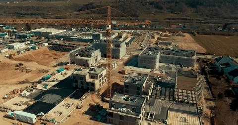 Tower Crane Beside Apartment Blocks, Residential Development, Aerial Drone Shot Stock Footage 340316783