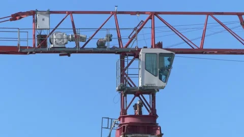Tower crane cabin close-up on the blue sky background, Urban development conc Stock Footage 171639834