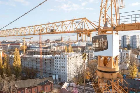 Tower crane cabin close up, construction of multi-storey buildings Stock Photos