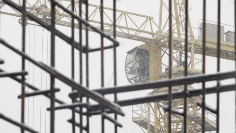 Tower crane cabin during snowfall at construction site Stock Footage 327041568