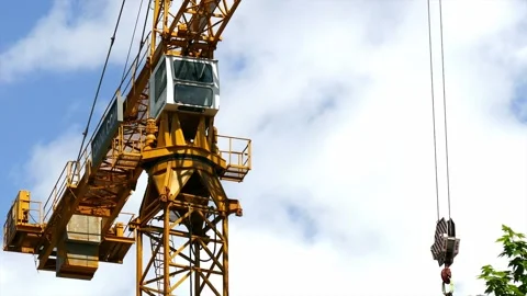 Tower crane carrying a load (medium shot). 스톡 동영상 145299815