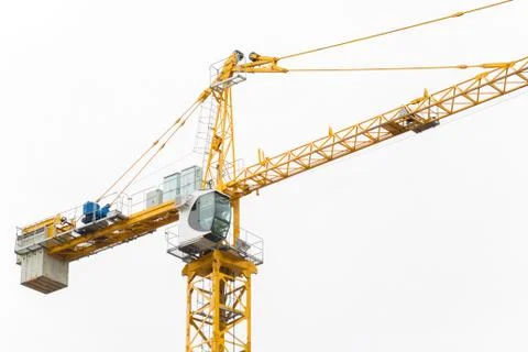 Tower crane closeup on the background of white sky Stock Photos