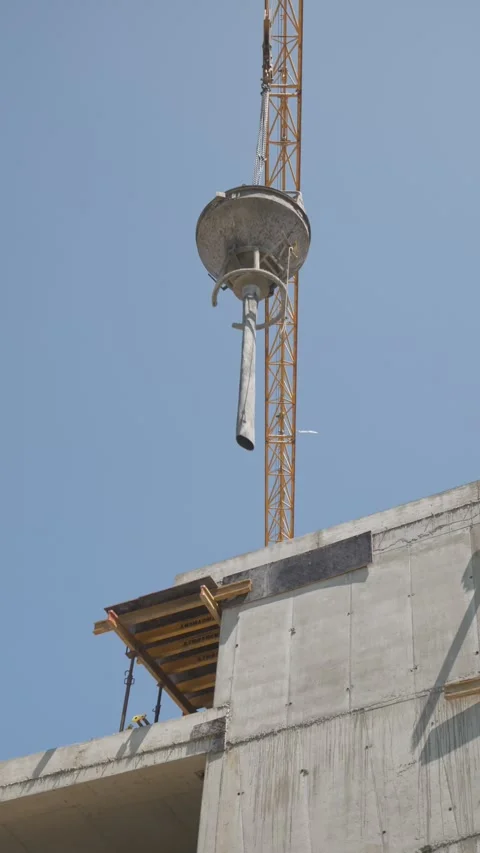 Tower Crane Concrete Bucket With Flexible Drop Chute Above Construction Site Stock Footage 346569049