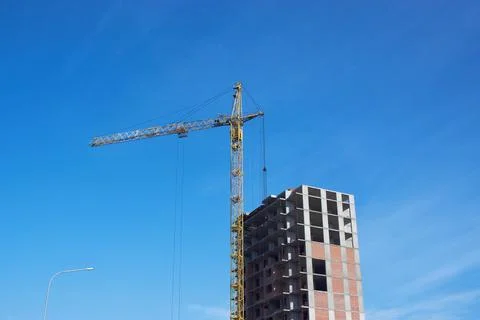 Tower crane on the construction of a house Stock Photos