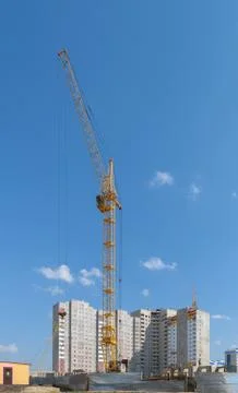 Tower crane on the construction of a new multi-storey house. Front view Stock Photos