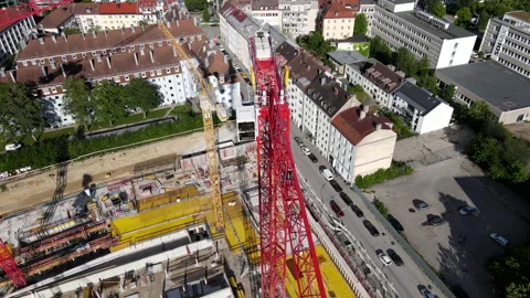 Tower crane at construction site, building yard, Aerial drone shot in 4k, urban Video stock 168630238