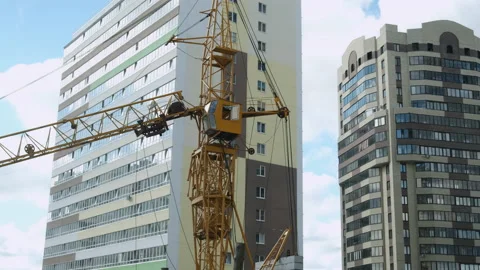 Tower crane on a construction site for lift a load at high-rise building. Video stock 145543809