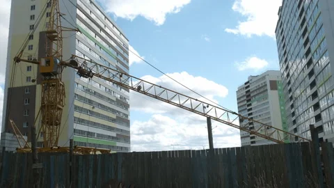Tower crane on a construction site for lift a load at high-rise building. Stock Footage 145967920