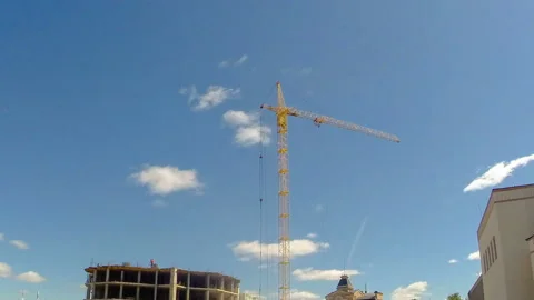 Tower crane at a construction site with workers to build a building. Time laps Stock Footage 108511883