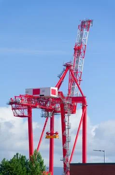 Tower crane high in sky at construction site Stock Photos