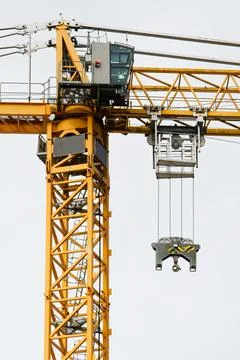 Tower crane high in sky at construction site Stock Photos