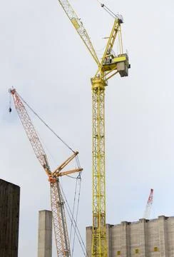 Tower crane high in sky at construction site Stock Photos