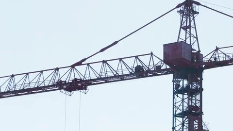 Tower Crane Jib With Moving Hoist Mechanism. Construction Machinery Operates On Stock Footage 323912474