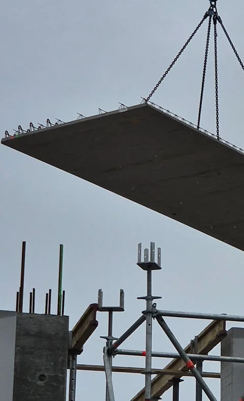 Tower Crane Lifting Concrete Slab in Rainy Weather Vertical Vidéo 332729680